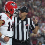 Oct 10, 2026; Tuscaloosa, Alabama, USA; Georgia Bulldogs quarterback Gunner Stockton (14) speaks with a referee before the game against the Alabama Crimson Tide at Saban Field at Bryant-Denny Stadium. Mandatory Credit: David Leong-Imagn Images