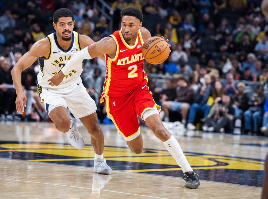 Oct 10, 2026; Indianapolis, Indiana, USA; Atlanta Hawks guard Aaron Wiggins (2) dribbles the ball while Indiana Pacers guard Ben Sheppard (26) defends in the second half at Gainbridge Fieldhouse. Mandatory Credit: Trevor Ruszkowski-Imagn Images