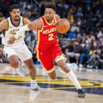 Oct 10, 2026; Indianapolis, Indiana, USA; Atlanta Hawks guard Aaron Wiggins (2) dribbles the ball while Indiana Pacers guard Ben Sheppard (26) defends in the second half at Gainbridge Fieldhouse. Mandatory Credit: Trevor Ruszkowski-Imagn Images
