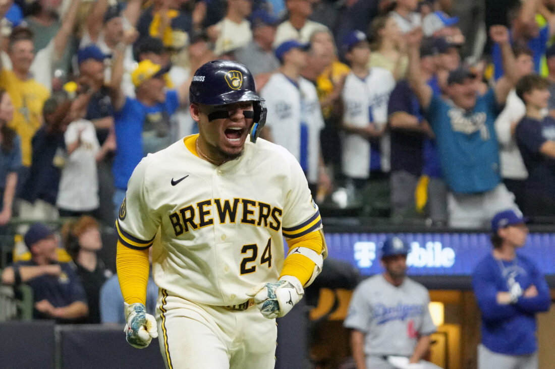 Oct 12, 2026; Milwaukee, Wisconsin, USA; Milwaukee Brewers catcher William Contreras (24) reacts while running after hitting an RBI single against Los Angeles Dodgers pitcher Brock Stewart (not pictured) during the sixth inning in game two of the NLCS for the 2026 MLB Playoffs at American Family Field. Mandatory Credit: Michael McLoone-Imagn Images