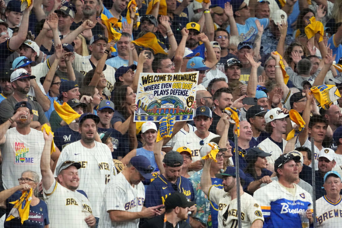 Oct 12, 2026; Milwaukee, Wisconsin, USA; Milwaukee Brewers fans cheer for their team against the Los Angeles Dodgers during the eighth inning in game two of the NLCS for the 2026 MLB Playoffs at American Family Field.