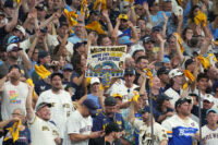 Oct 12, 2026; Milwaukee, Wisconsin, USA; Milwaukee Brewers fans cheer for their team against the Los Angeles Dodgers during the eighth inning in game two of the NLCS for the 2026 MLB Playoffs at American Family Field.