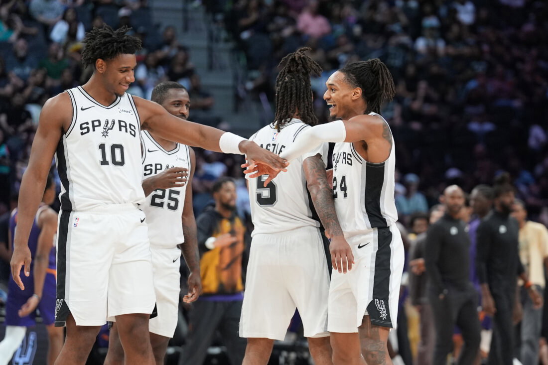 Oct 14, 2026; San Antonio, Texas, USA; San Antonio Spurs guard Devin Vassell (24) celebrates with center Tarris Reed Jr. (10) in the second half at Frost Bank Center. Mandatory Credit: Daniel Dunn-Imagn Images