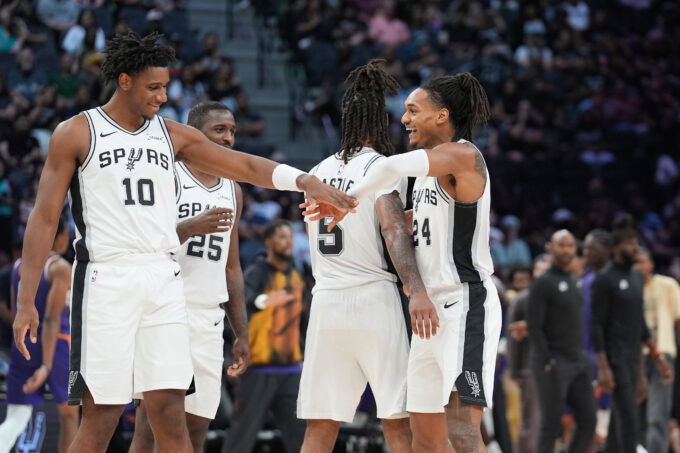 Oct 14, 2026; San Antonio, Texas, USA; San Antonio Spurs guard Devin Vassell (24) celebrates with center Tarris Reed Jr. (10) in the second half at Frost Bank Center. Mandatory Credit: Daniel Dunn-Imagn Images