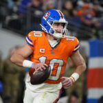 Oct 15, 2026; Denver, Colorado, USA; Denver Broncos quarterback Bo Nix (10) looks to throw in the second half against the Seattle Seahawks at Empower Field at Mile High. Mandatory Credit: Ron Chenoy-Imagn Images