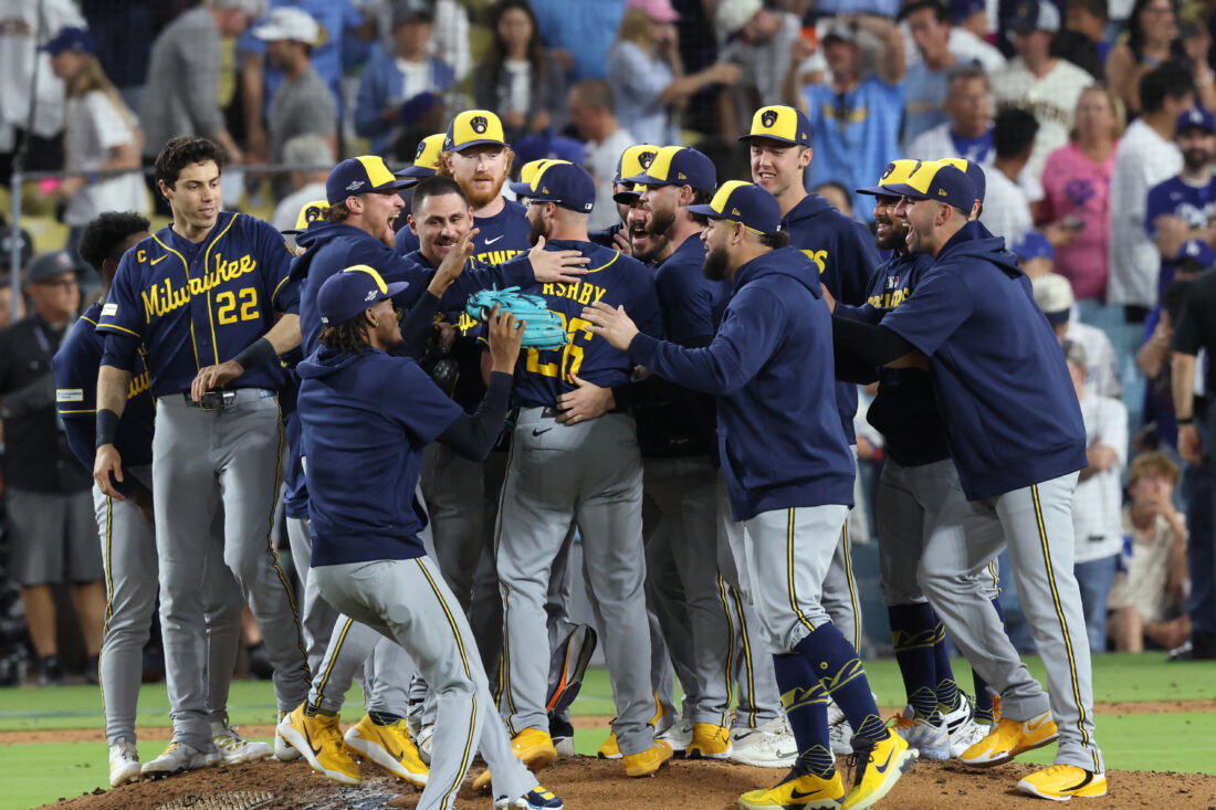 Oct 15, 2026; Los Angeles, California, USA; Milwaukee Brewers players celebrate winning the NLCS for the 2026 MLB Playoffs against the Los Angeles Dodgers at Uniqlo Field at Dodger Stadium. Mandatory Credit: Kiyoshi Mio-Imagn Images