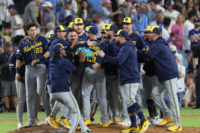 Oct 15, 2026; Los Angeles, California, USA; Milwaukee Brewers players celebrate winning the NLCS for the 2026 MLB Playoffs against the Los Angeles Dodgers at Uniqlo Field at Dodger Stadium. Mandatory Credit: Kiyoshi Mio-Imagn Images