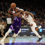 Oct 16, 2026; Phoenix, Arizona, USA; Utah Jazz forward Ace Bailey (19) dribbles against Phoenix Suns guard Jordan Goodwin (23) in the first half at Mortgage Matchup Center. Mandatory Credit: Anna Carrington-Imagn Images