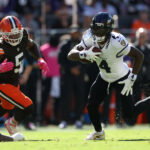 Oct 18, 2026; Cleveland, Ohio, USA; Baltimore Ravens wide receiver Zay Flowers (4) runs the ball ahead of Cleveland Browns linebacker Quincy Williams (5) in the first quarter at Huntington Bank Field. Mandatory Credit: Scott Galvin-Imagn Images