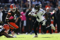 Oct 18, 2026; Cleveland, Ohio, USA; Baltimore Ravens wide receiver Zay Flowers (4) runs the ball ahead of Cleveland Browns linebacker Quincy Williams (5) in the first quarter at Huntington Bank Field. Mandatory Credit: Scott Galvin-Imagn Images