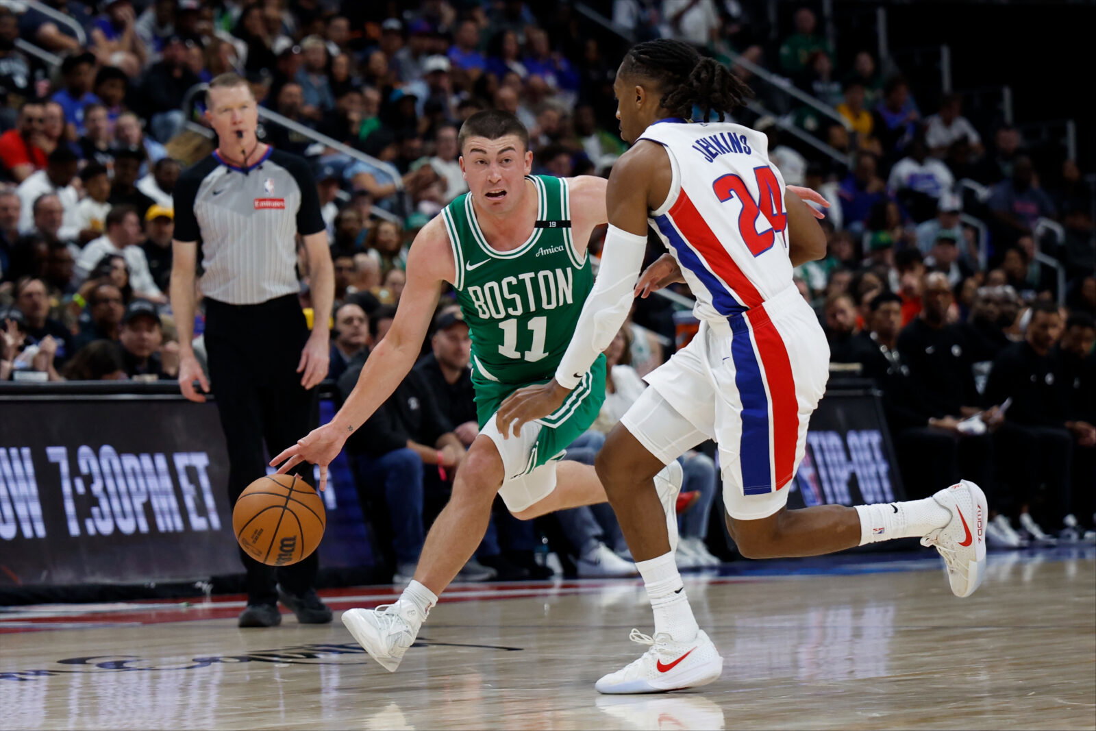 Oct 20, 2026; Detroit, Michigan, USA; Boston Celtics guard Payton Pritchard (11) dribbles defended by Detroit Pistons guard Daniss Jenkins (24) in the second half at Little Caesars Arena. Mandatory Credit: Rick Osentoski-Imagn Images