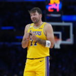 Oct 21, 2026; Los Angeles, California, USA; Los Angeles Lakers guard Luka Doncic (77) reacts against the Golden State Warriors in the first half at Crypto.com Arena. Mandatory Credit: Kirby Lee-Imagn Images