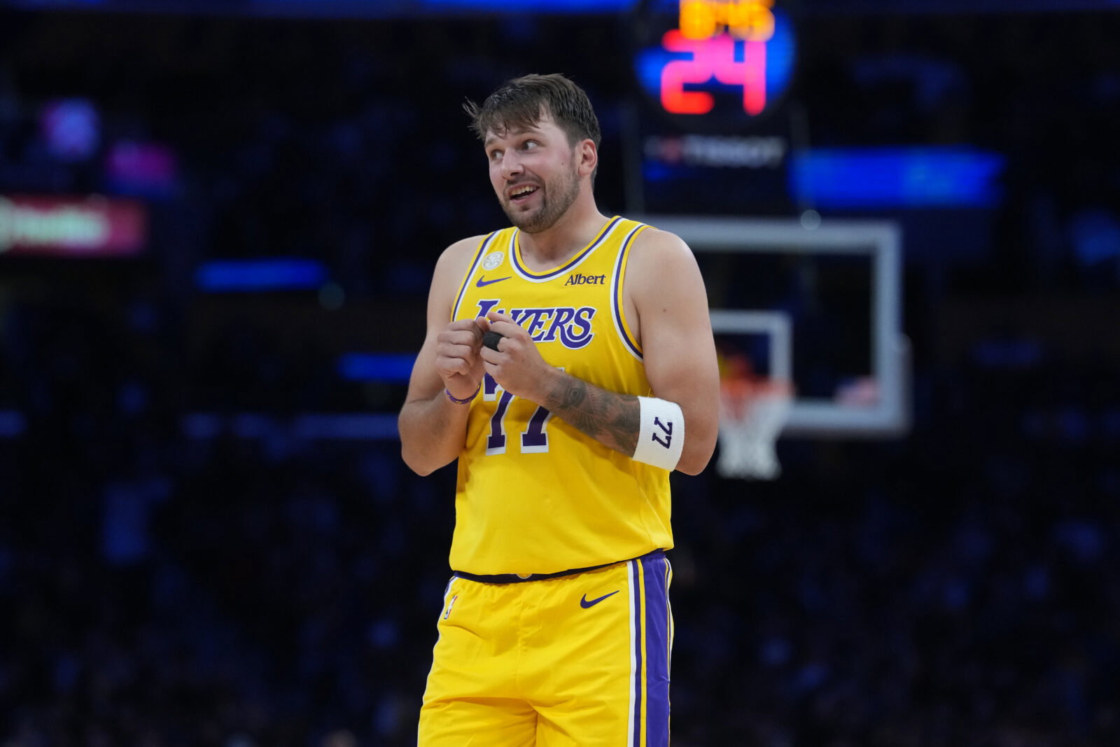 Oct 21, 2026; Los Angeles, California, USA; Los Angeles Lakers guard Luka Doncic (77) reacts against the Golden State Warriors in the first half at Crypto.com Arena. Mandatory Credit: Kirby Lee-Imagn Images