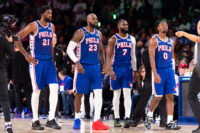 Oct 22, 2026; Philadelphia, Pennsylvania, USA; Philadelphia 76ers Joel Embiid (21) and LeBron James (23) and Jaylen Brown (7) and Tyrese Maxey (0) walk back on the court after a break in action against the Cleveland Cavaliers during the fourth quarter at Xfinity Mobile Arena. Mandatory Credit: Bill Streicher-Imagn Images