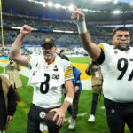 Oct 25, 2026; Paris, FRA; Pittsburgh Steelers quarterback Aaron Rodgers (8) and defensive tackle Cameron Heyward (97) wave to fans as they leave the field after defeating the New Orleans Saints at Stade de France Stadium. Mandatory Credit: Kirby Lee-Imagn Images