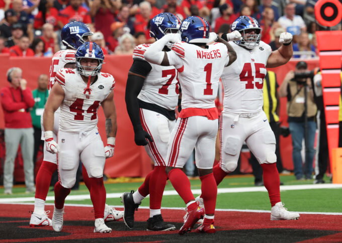Oct 25, 2026; Houston, Texas, USA; New York Giants wide receiver Malik Nabers (1) and fullback Patrick Ricard (45) mimics the strength of running back Cam Skattebo (44) after he powered himself into a touchdown against the Houston Texans in the second half at Reliant Stadium. Mandatory Credit: Thomas Shea-Imagn Images