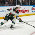 Oct 25, 2026; Vancouver, British Columbia, CAN; Minnesota Wild defenseman Quinn Hughes (43) handles the puck against the Vancouver Canucks in the second period at Rogers Arena. Mandatory Credit: Bob Frid-Imagn Images