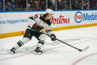 Oct 25, 2026; Vancouver, British Columbia, CAN; Minnesota Wild defenseman Quinn Hughes (43) handles the puck against the Vancouver Canucks in the second period at Rogers Arena. Mandatory Credit: Bob Frid-Imagn Images