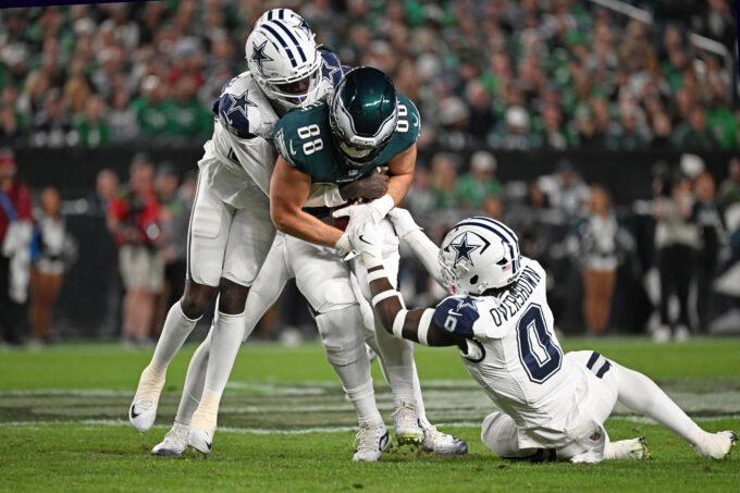 Oct 26, 2026; Philadelphia, Pennsylvania, USA; Philadelphia Eagles tight end Dallas Goedert (88) is tackled by Dallas Cowboys cornerback Joey Porter Jr. (25) and linebacker DeMarvion Overshown (0) during the first half at Lincoln Financial Field. Mandatory Credit: Eric Hartline-Imagn Images
