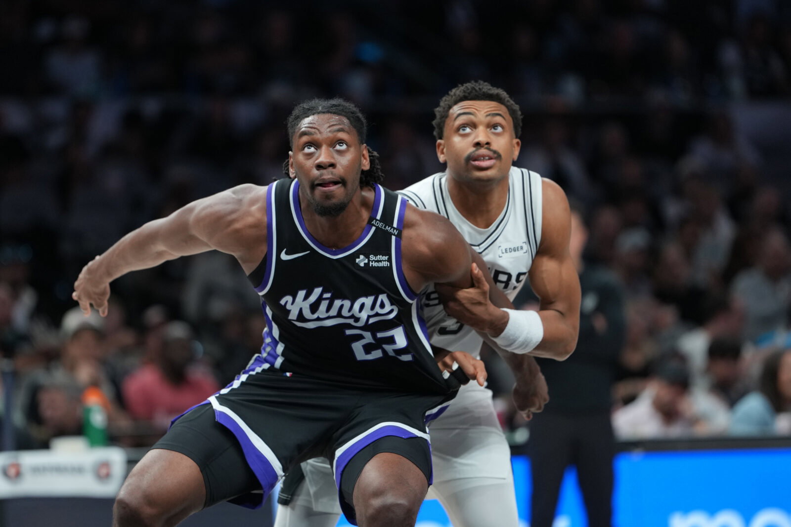 Oct 27, 2026; San Antonio, Texas, USA; Sacramento Kings forward Jonathan Mogbo (22) and San Antonio Spurs forward Keldon Johnson (3) battle for position in the second half at Frost Bank Center. Mandatory Credit: Daniel Dunn-Imagn Images